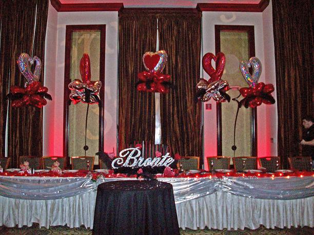 Mylar heart arch with ostrich feathers and name centerpiece